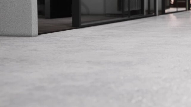 Smooth concrete floor surface inside a modern building with clean lines and open space during daytime