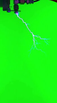 Realistic electric plasma arc discharge with jumping sparks on bright green background