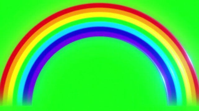 Vibrant colorful rainbow arch appearing and gradually fading out against a bright green screen background