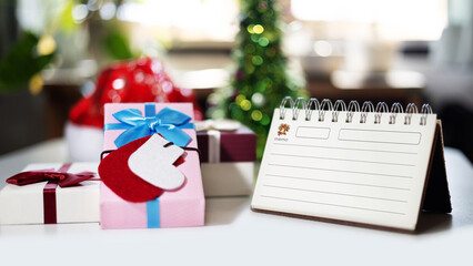 close-up shot, gift box with christmas background on table with diary for new year's greetings message, celebration for new year 2027 concept © Lek