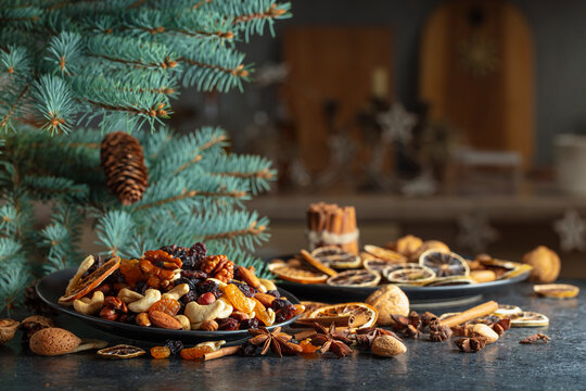 Christmas still-life with spruce branches and dried fruits.