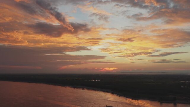 Aerial View of Cruise Ship Sailing on Yangtze River at Dramatic Sunset Glow   