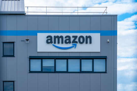 amazon distribution center logistics building exterior, blue warehouse, corporate logo sign, industrial architecture, storage facility, delivery center hub, business infrastructure Darmstadt, Germany