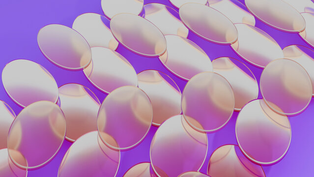 Transparent oval gel capsules on purple background
