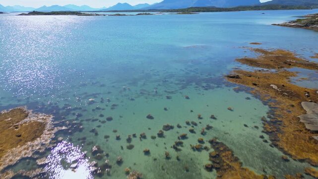 Norway natural landscape in the north, Norland, Hamaroy area. Drone aerial fast moving landscape of Northern Norway with sea and mountains in Scandinavia