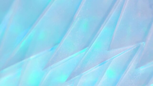 Pastel abstract geometric background with layered translucent shapes and sparkling texture