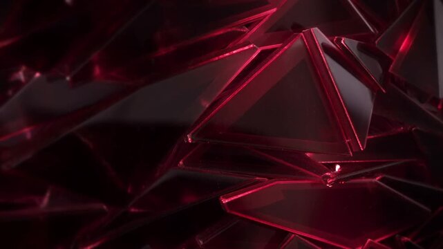 Glossy red and black triangular glass shards cluster and shift in layered abstract arrangement