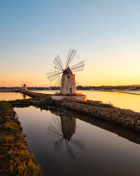 Sicilian salt culture in Saline Marsala at sunset