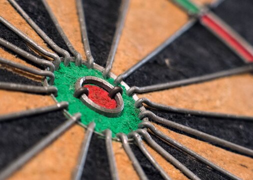 acro close up of a classic sisal dartboard bullseye target area with wire dividers