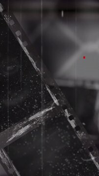 Vertical video: From top left film strip sliding, showing holes, dust falling, evoking retro feel