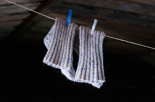 Woolen socks hanging on clothes line