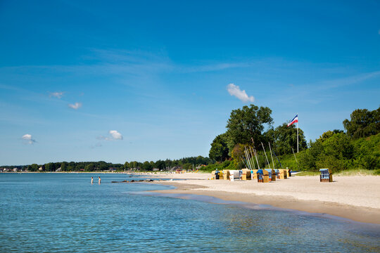 Beach with sandy shore and beach chairs on Baltic Coast in a beach