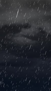 Vertical video: Wind moving clouds, rain streaks falling slanted and varying, showing ongoing storm