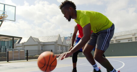 Front view of African american basketball players playing basketball in basketball court © WavebreakMediaMicro