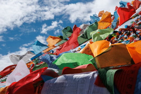 The Changqing Chunker Temple  in Litang, China. Many colourful prayer flags on the mountain top beside the temple.Spirituality and meditation.