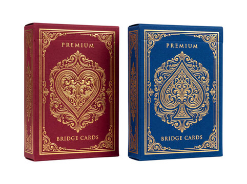 Close-up of two premium bridge tuck boxes, one deep crimson and one royal blue, with gold foil embossed spade and heart emblems, standing side by side, isolated on pure white background