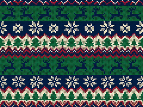 Closeup of a colorful knitted christmas sweater pattern with reindeer snowflakes and geometric designs on a festive holiday background