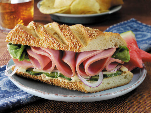 Ham and swiss cheese sandwich with lettuce and cucumber Dijon Mustard