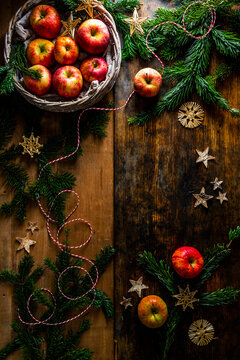 Christmas decoration with apples, fir branches