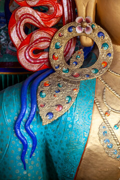 Jeweled earring and blue hair locks of the Maitreya Buddha statue at Thiksey monastery, Ladakh, Thiksey, India