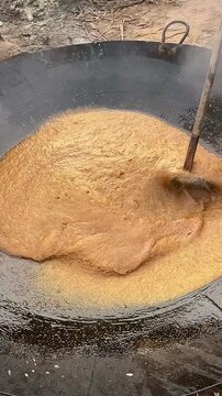 Traditional Gur Mixing Process During Homemade Jaggery Production