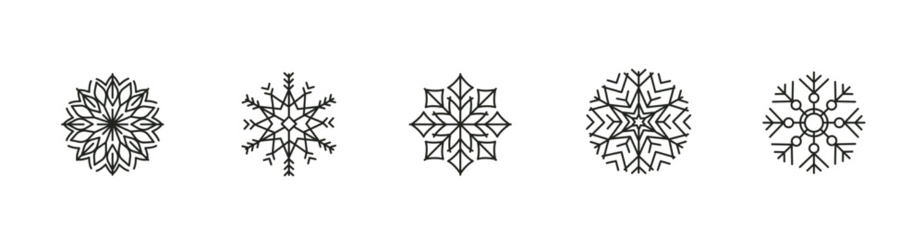 Set of geometric snowflake designs in black and white