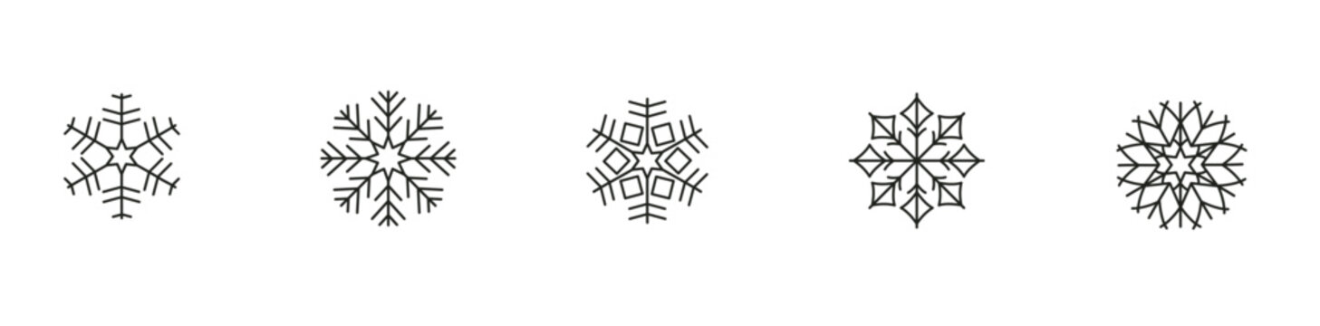 Intricate black and white geometric snowflake designs on white background