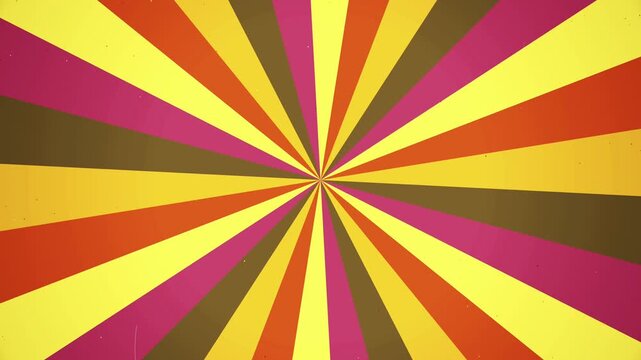 Vibrant rotating retro sunburst background features warm yellow orange red and brown rays. this vintage starburst pattern creates a dynamic aesthetic.