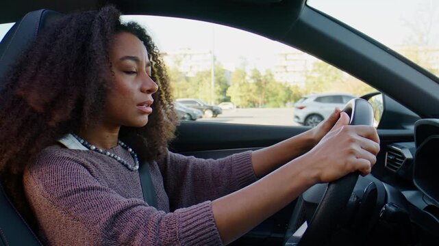Angry woman argues with driver ahead while sitting in car