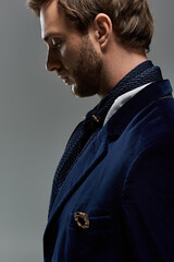 Elegant and bearded gentleman poses in refined vintage menswear with timeless poise © LIGHTFIELD STUDIOS
