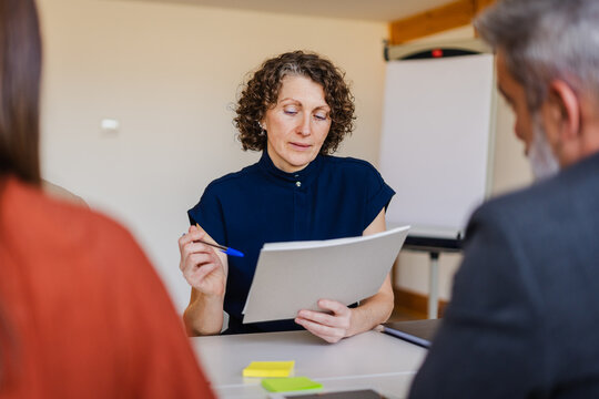 Businesswoman reviews documentation