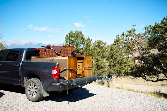 Pickup truck loaded with furniture for moving