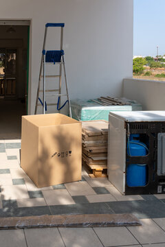 Home renovation supplies and equipment on a patio