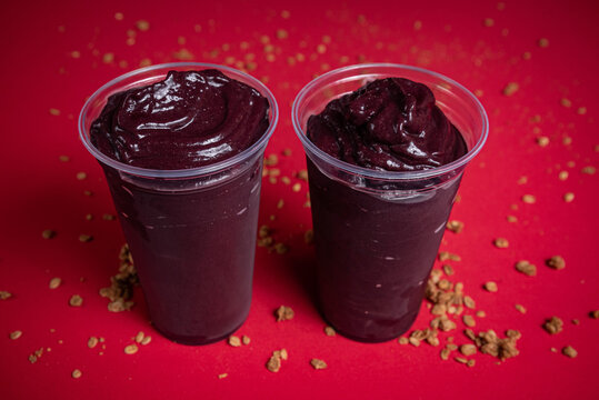 Two acai berry bowls with granola topping