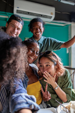 Friends taking selfies, having fun