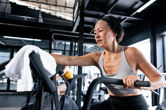 Portrait of an elderly woman working out indoors