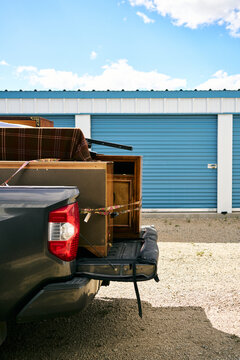 Pickup truck loaded with furniture at storage facility