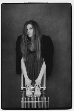 A film portrait of a woman wearing a jacket and a jeans