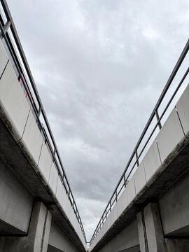 Symmetrical Concrete Overpass with Clouded Sky