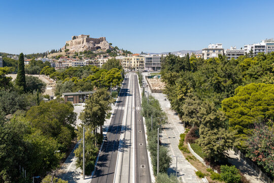 Acropolis and urban tram line connecting Athens cityscape