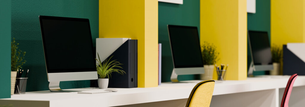 3D Illustration of Creative Office Workstations with Green and Yellow Wall, Computers, and Plants on White Desk