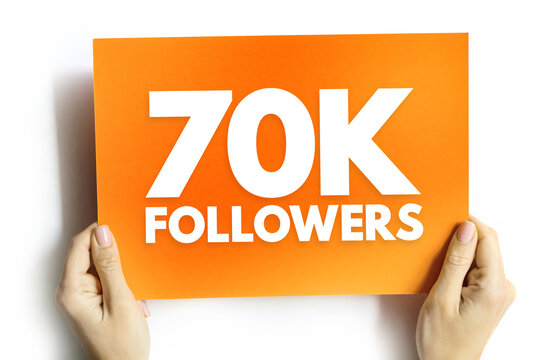 70K Followers text on card held by hands, concept for social media milestone, online community, digital growth or internet popularity celebration background
