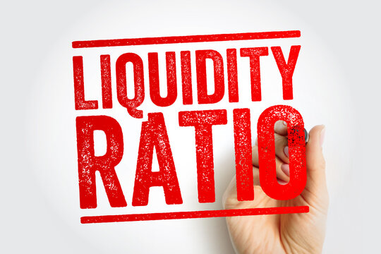 LIQUIDITY RATIO displayed in bold red stamp text, held by a hand writing the phrase, symbolizing finance metrics, solvency analysis, accounting evaluations and business performance concepts
