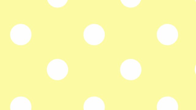 Polka dot pattern on pastel yellow