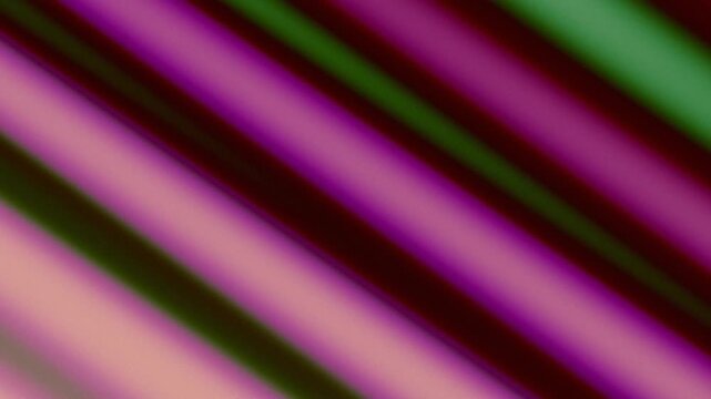 Vibrant abstract diagonal lines in purple, green, and red background