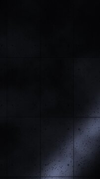 Animaci&oacute;n en bucle de muro de hormig&oacute;n oscuro con un haz de luz que
