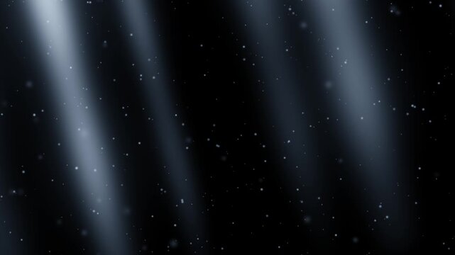 Cold icy blue and white light beams with softly falling snow on a black background. Seamless winter overlay loop. Use screen or add blend mode over footage.