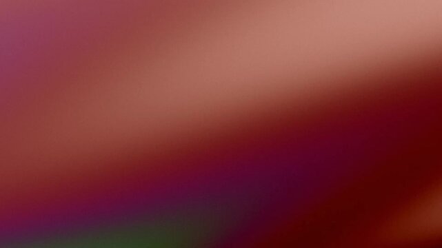 Warm grainy gradient background with red, purple, and brown colors
