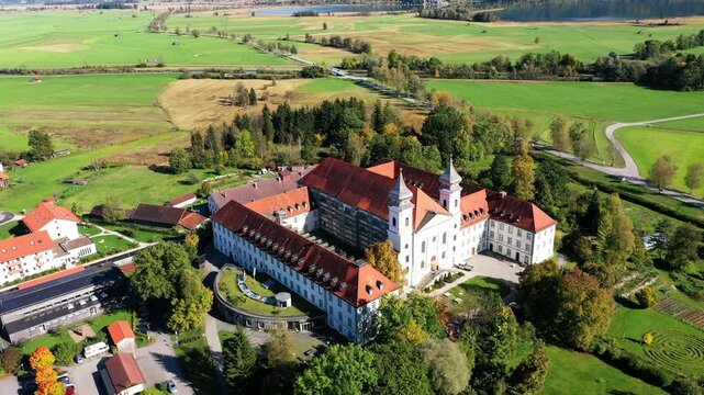 Aerial view, flight at Schlehdorf monastery with parish church St. Tertulin on Kochelsee, Schlehdorf Upper Bavaria, Bavaria, Germany
