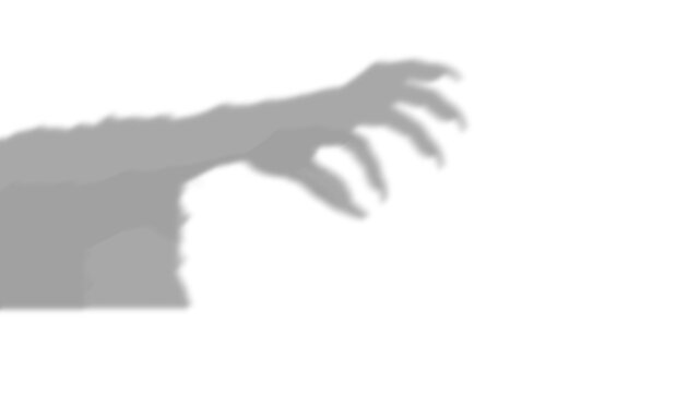 A dark scary shadow of a monster hand making a reaching gesture towards the viewer captured as an isolated object on isolated on transparent background